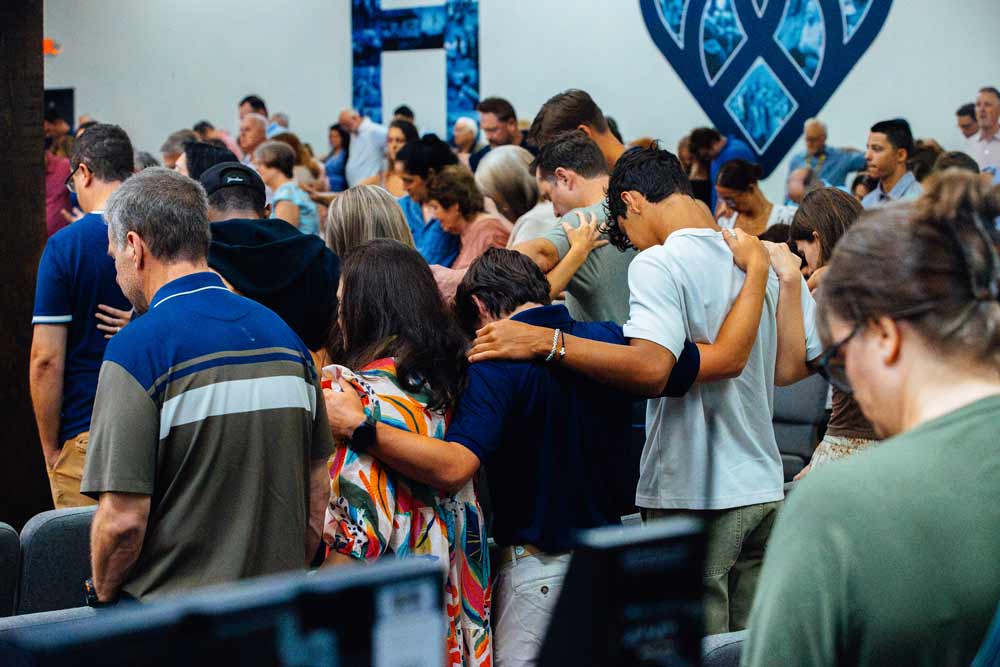 Members of our church praying together